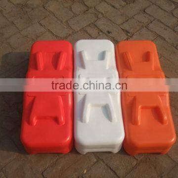 Colourful plastic temporary fence feet with concrete