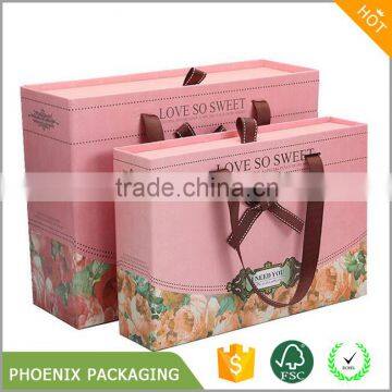 Elegant pink gift paper box with ribbon