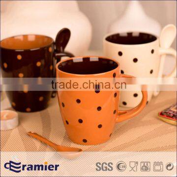 Ceramic stoneware coffee mug with spoon with handmade dots