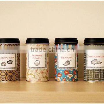 round printed tea tins