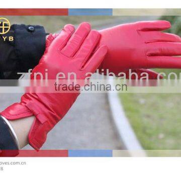 woman custom made putting on leather gloves