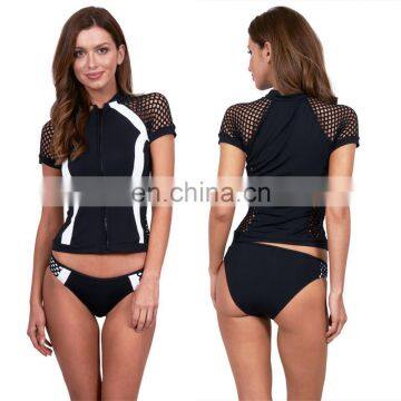 Rash guard manufacturer custom black and white short sleeve zip up panelling mesh surf lycra rash guard for ladies