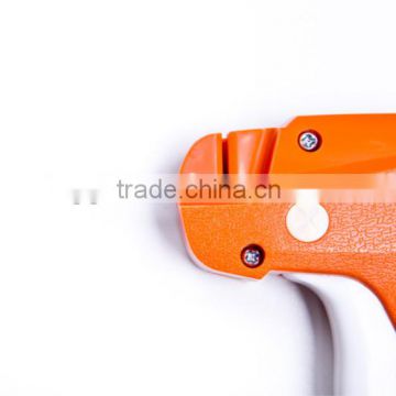 Handheld tag gun