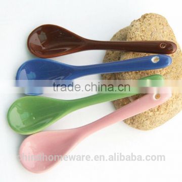 colorful ceramic spoons with hole