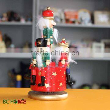 8 inch christmas wooden music box with wooden nutcracker on it.