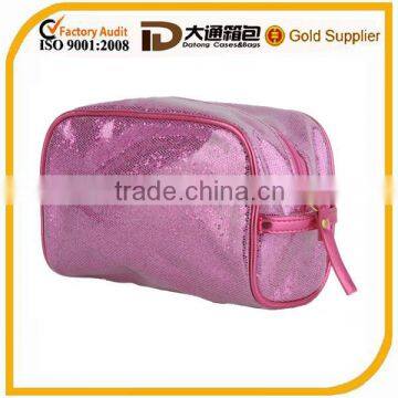 Fully lined cosmetic bag features sparkling glitter and metallic leatherette trim