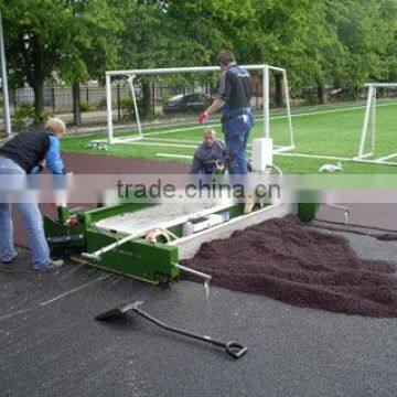 Rubber surface paving machine