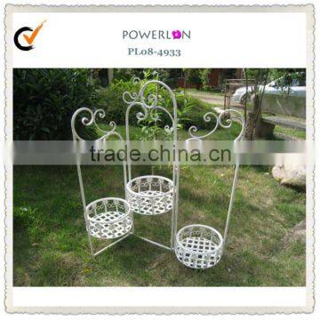 Antique metal plant pot trellis