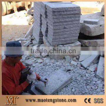 Natural granite stone palisade fence with pineappled surface