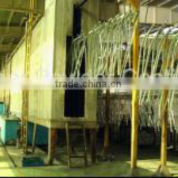 Vertical pretreatment shower system for table leg powder coating line