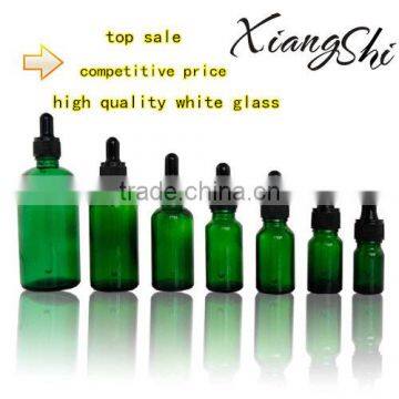 green glass essential oil bottles with plastic dropper