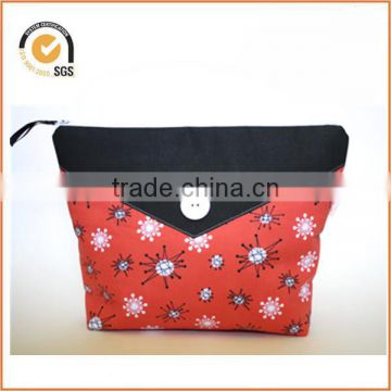 Retro Style Zipper Pouch/Makeup Bag: Coral Mid Century Atomic Fabric with Black Contrast And White Buttons By Chiqun Dongguan