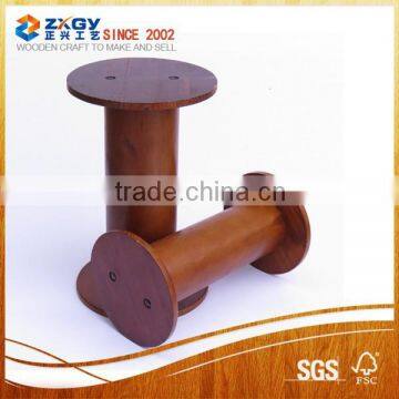 Brown wooden thread spools empty ribbon spools