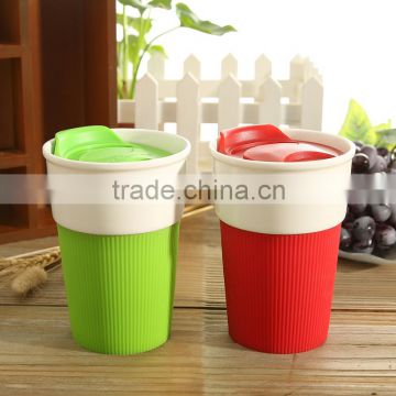 Ceramic coffee cup with silicone sleeve insulation