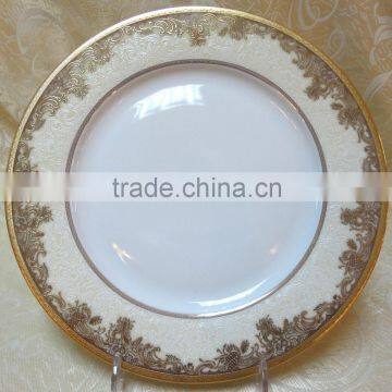 Porcelain dinnerware set with embossed gold and embossed white porcelain