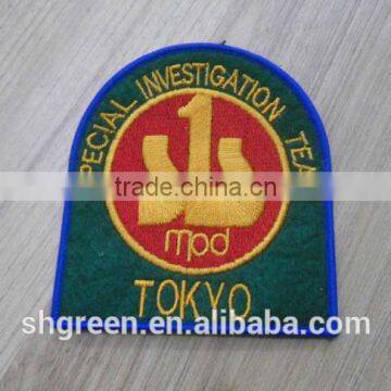 Dark green felt embroidery badge for blazer