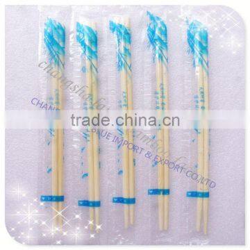 bamboo twin chopsticks with opened paper sleeve packing