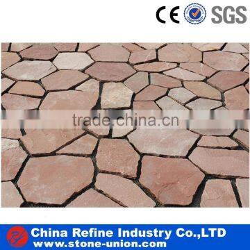 Red porphyry paving stone on mesh