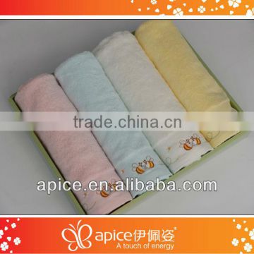 solid color bath towel with embroidered border