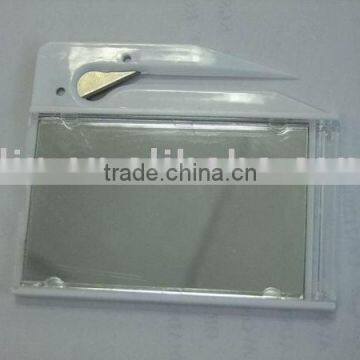 letter opener with business card holder and cosmetic mirror