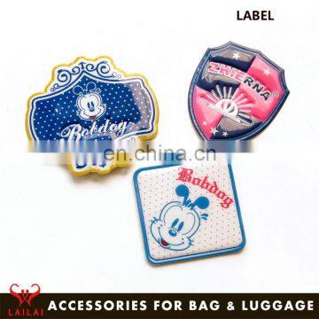 Custom pvc tag plastic embossed logo silicone label for bags accessories