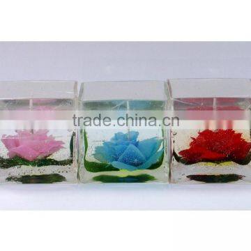 beautiful flowers in transparent glass jelly candle