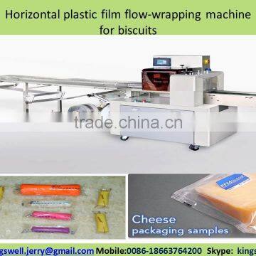 Horizontal plastic film flow-wrapping machine