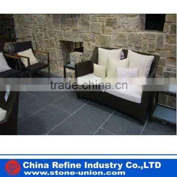 Honed black floor andesite