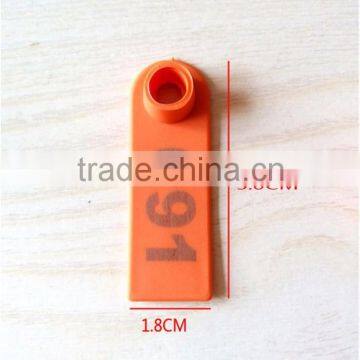 orange sheep ear tag