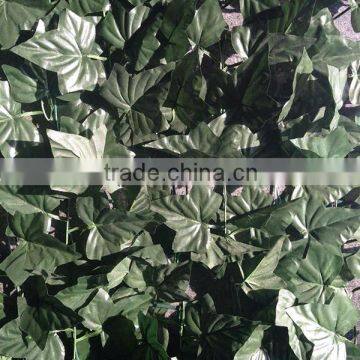 Dark green artificial ivy fence for garden decoration