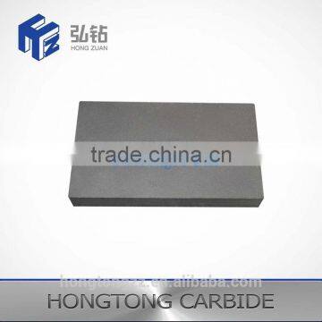 Metal cutting tool of cemented carbide board plate