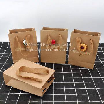 Yellow kraft paper shopping bag with string