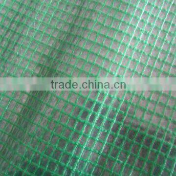 Strong clear or green mesh tarpaulin sheet used for building trade