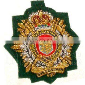 Royal Logistic Corps beret badge - commando green