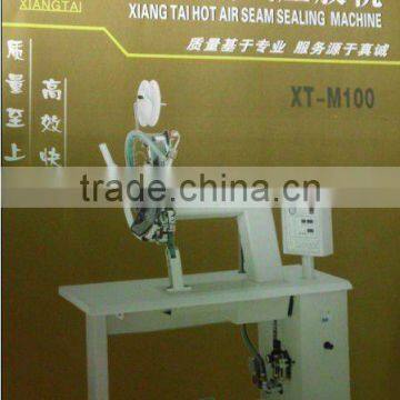 Raincoat seam sealing tape machine