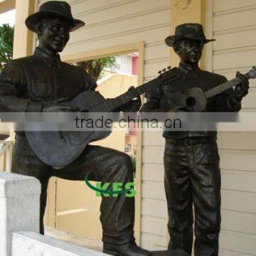 Bronze European band playing guitar statue