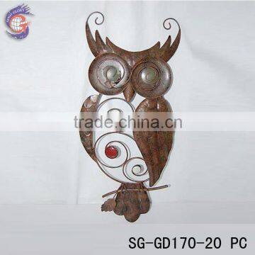 metal glow in the dark owl on the wall