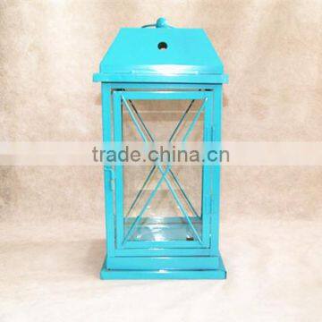 blue metal lantern with clear glass wall