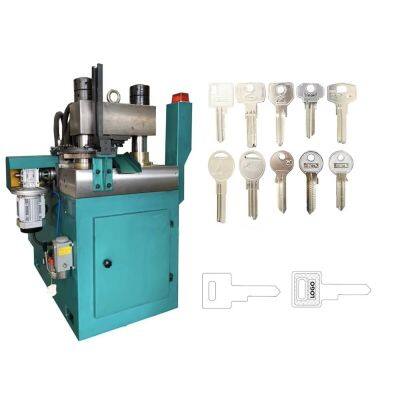 Автоматическая машина для изготовления ключей. Машина для тиснения ключей. Машина для тиснения логотипов на ключах.