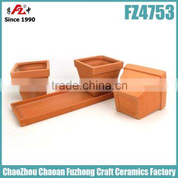 Small and rectangular clay planter with saucer