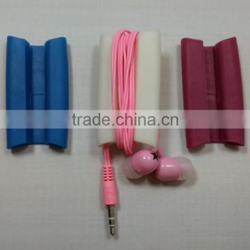 Earbud cord wrap & phone stand