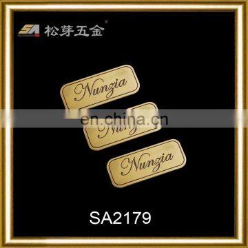 Brushed gold custom metal logo for handbags