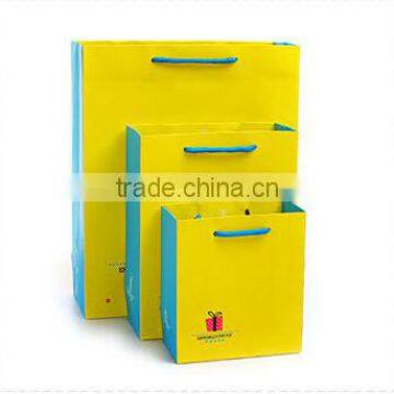 bright yellow color fancy paper shopping bag