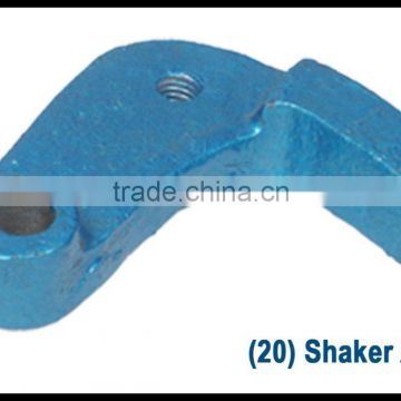 Shaker arm for grinding mill