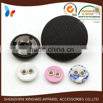 black fabric covered button with metal shank