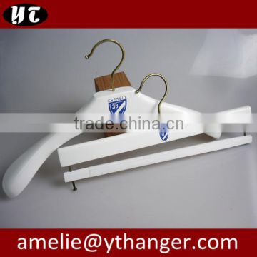 white wooden coat hanger and pants hanger for shop store