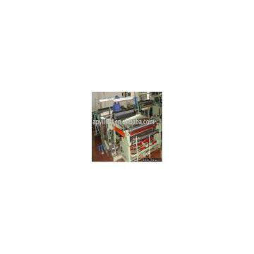 shuttless weaving machine