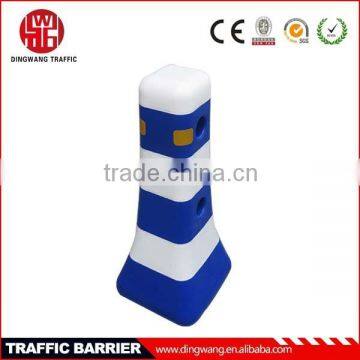 Blue and white plastic road safety barrier