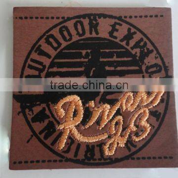 custom leather label with embroidery technology