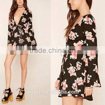 A Woven Floral Print Skater Dress With Long Bell Sleeves a Plunging V-neckline Side Zipper